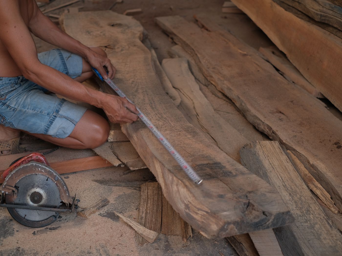 A carpenter working with timber on site