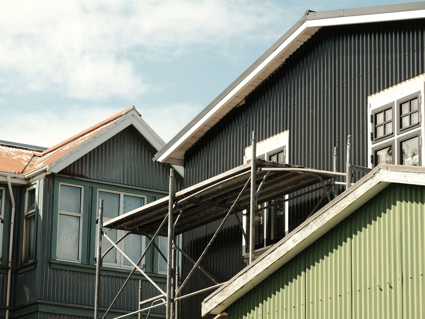 A standing seam metal roof in sunlight